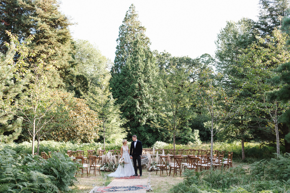 Ceremony Woodland Outdoor Circle Round Chairs Flowers Pampas Grass Palm Leaves Dahlias Aisle Boconnoc Wedding Debs Alexander Photography