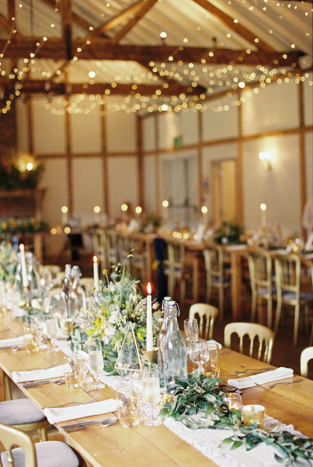 Barn Reception Fairy Lights Candles Long Tables Decor Burley Manor Wedding Becky Bailey Photographer