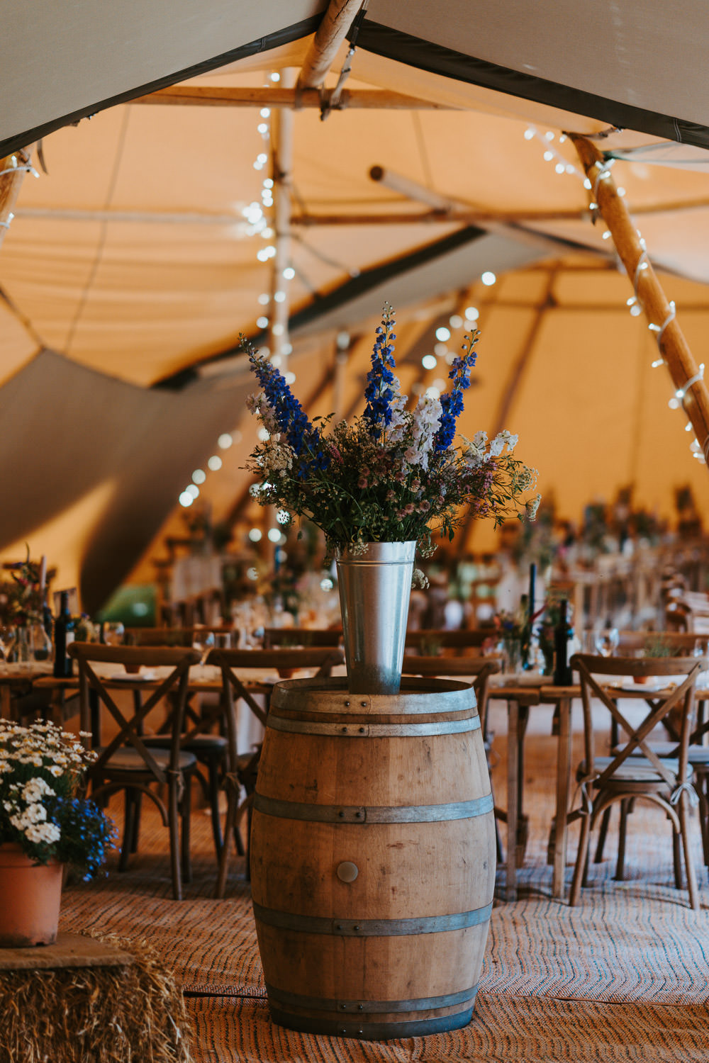 Tipi Wooden Long Tables Fairy Lights Flowers Country Festival Wedding Jonny Gouldstone Photography
