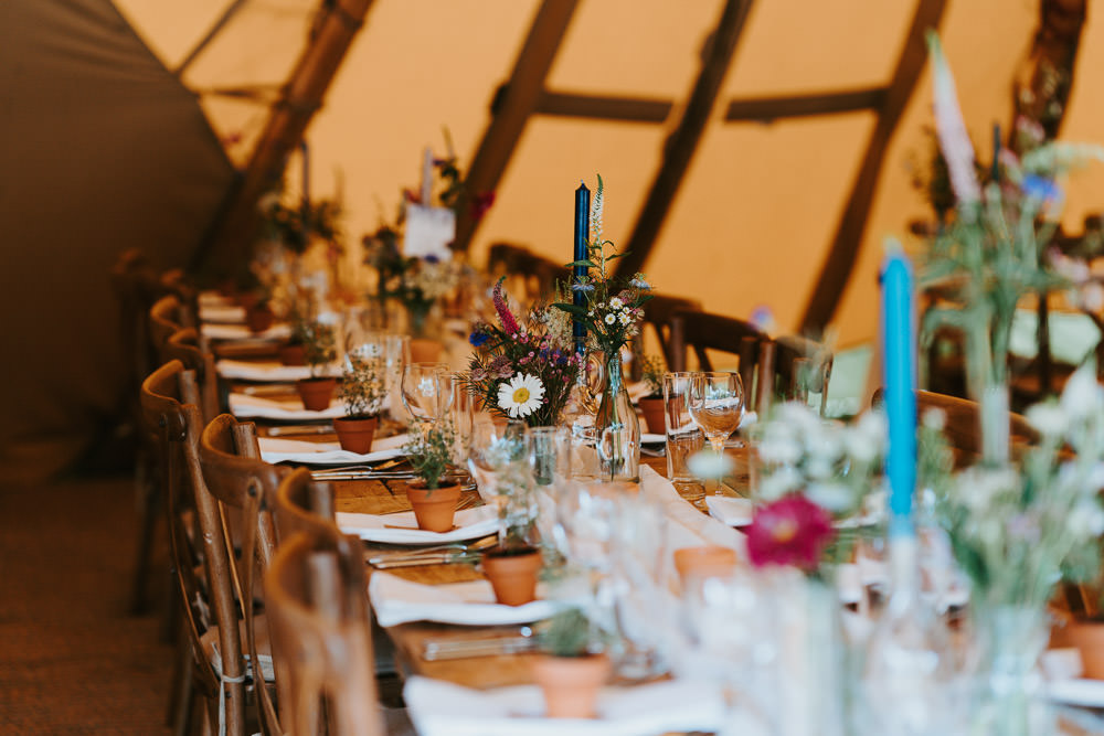 Tipi Wooden Long Tables Fairy Lights Flowers Country Festival Wedding Jonny Gouldstone Photography