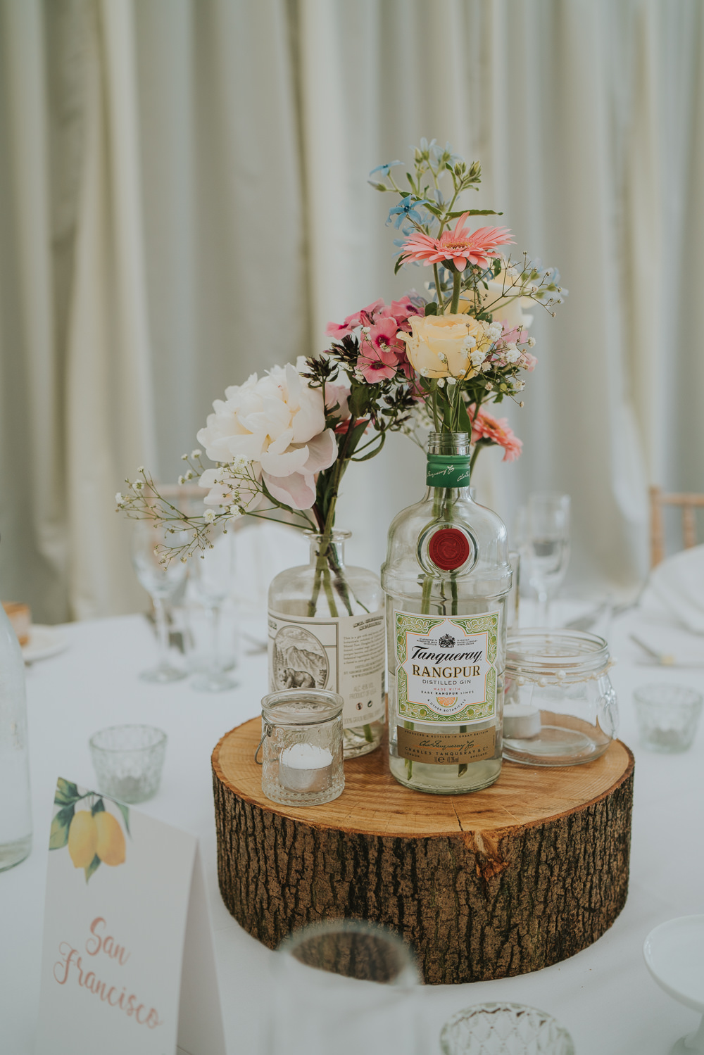 Centrepiece Decor Table Log Slice Bottle Flowers High House Weddings Grace Elizabeth Photography