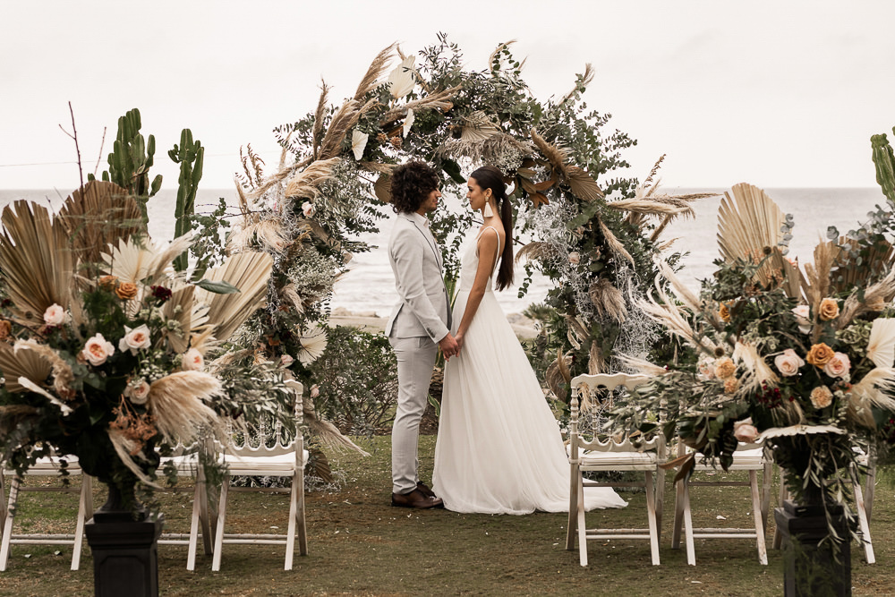 Flowers Dried Palm Leaves Greenery Foliage Orange Rose Pampas Grass Flower Arch Marbella Elopement Wedding Nora Photography