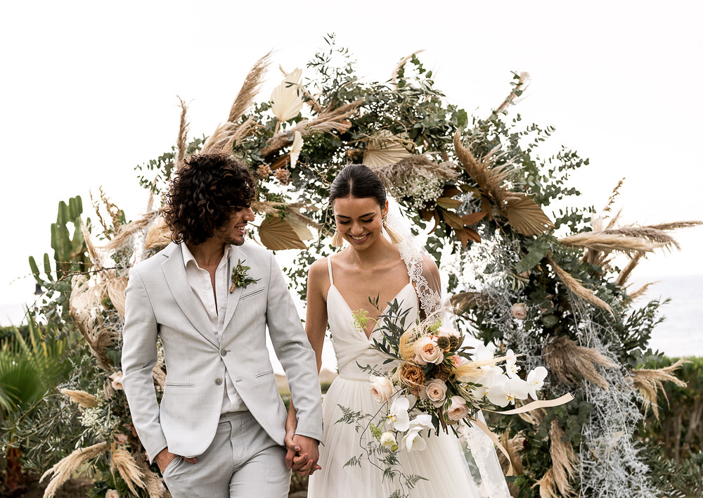 Flowers Dried Palm Leaves Greenery Foliage Orange Rose Pampas Grass Flower Arch Marbella Elopement Wedding Nora Photography