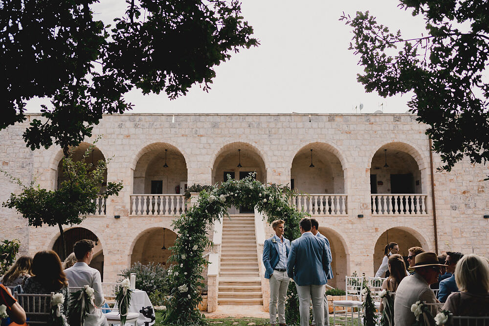 Outdoor Ceremony Flower Arch Greenery Foliage Backdrop Puglia Wedding MIKI Studios