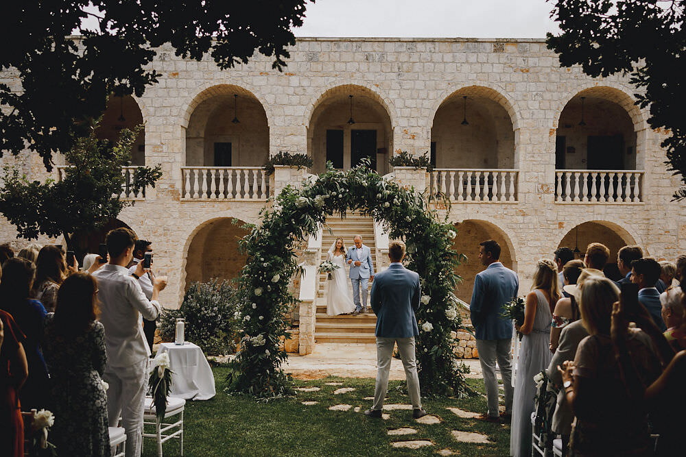 Outdoor Ceremony Flower Arch Greenery Foliage Backdrop Puglia Wedding MIKI Studios