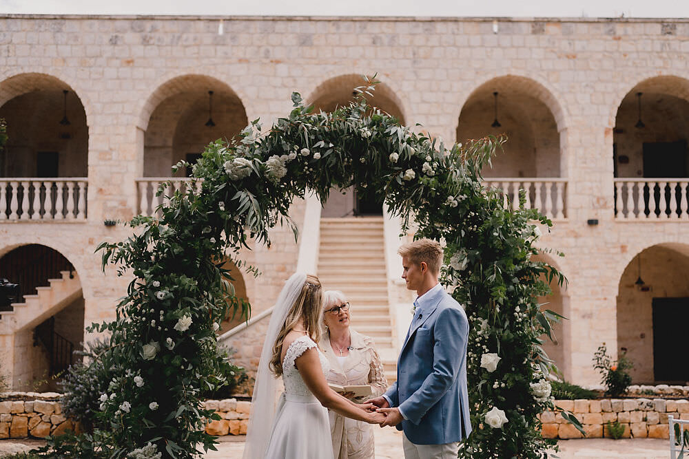 Puglia Wedding MIKI Studios Outdoor Ceremony Flower Arch Greenery Foliage Backdrop