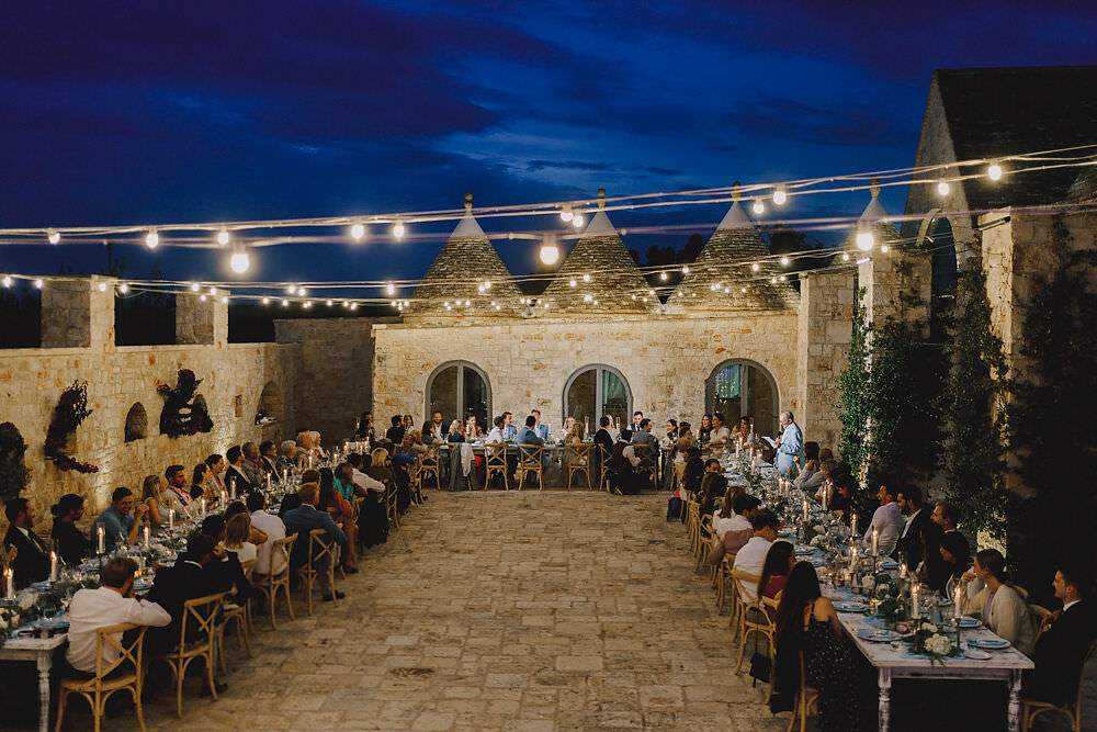 Outdoor Reception Festoon Lights U Table Greenery Foliage Candles Decor Puglia Wedding MIKI Studios