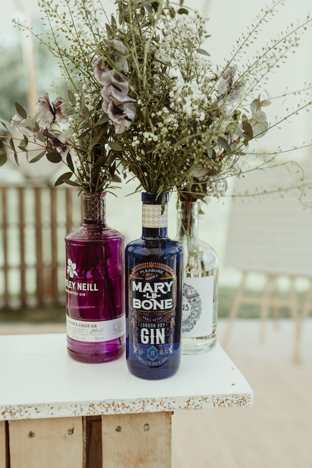 Gin Bottle Flowers Decor Red Brick Barn Wedding Jess Soper Photography