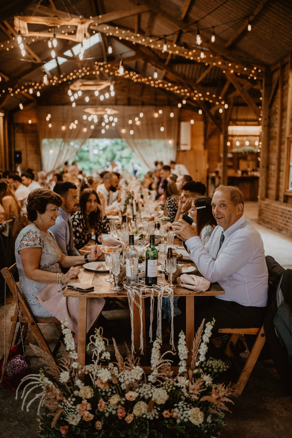 Barn Lights Lighting Flowers Long Tables Decor Whimsical Boho Wedding Camilla Andrea Photography
