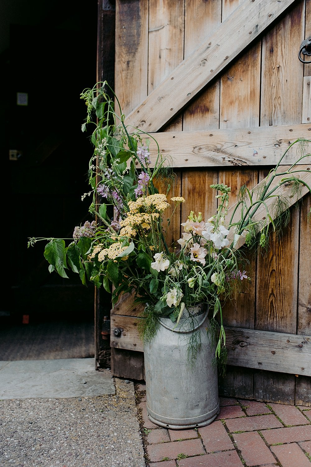 Milk Churn Flowers Entrance Belbroughton Church Hall Wedding Faye Green Photo