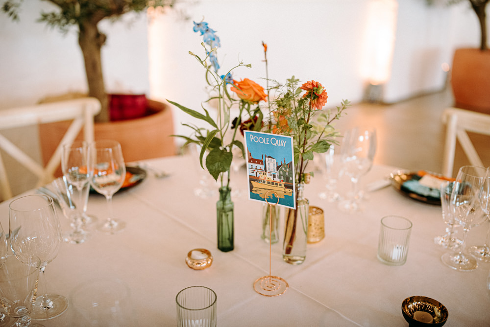 Table Flowers Bottles Centrepiece British Nigerian Wedding Andrew Brannan Photography