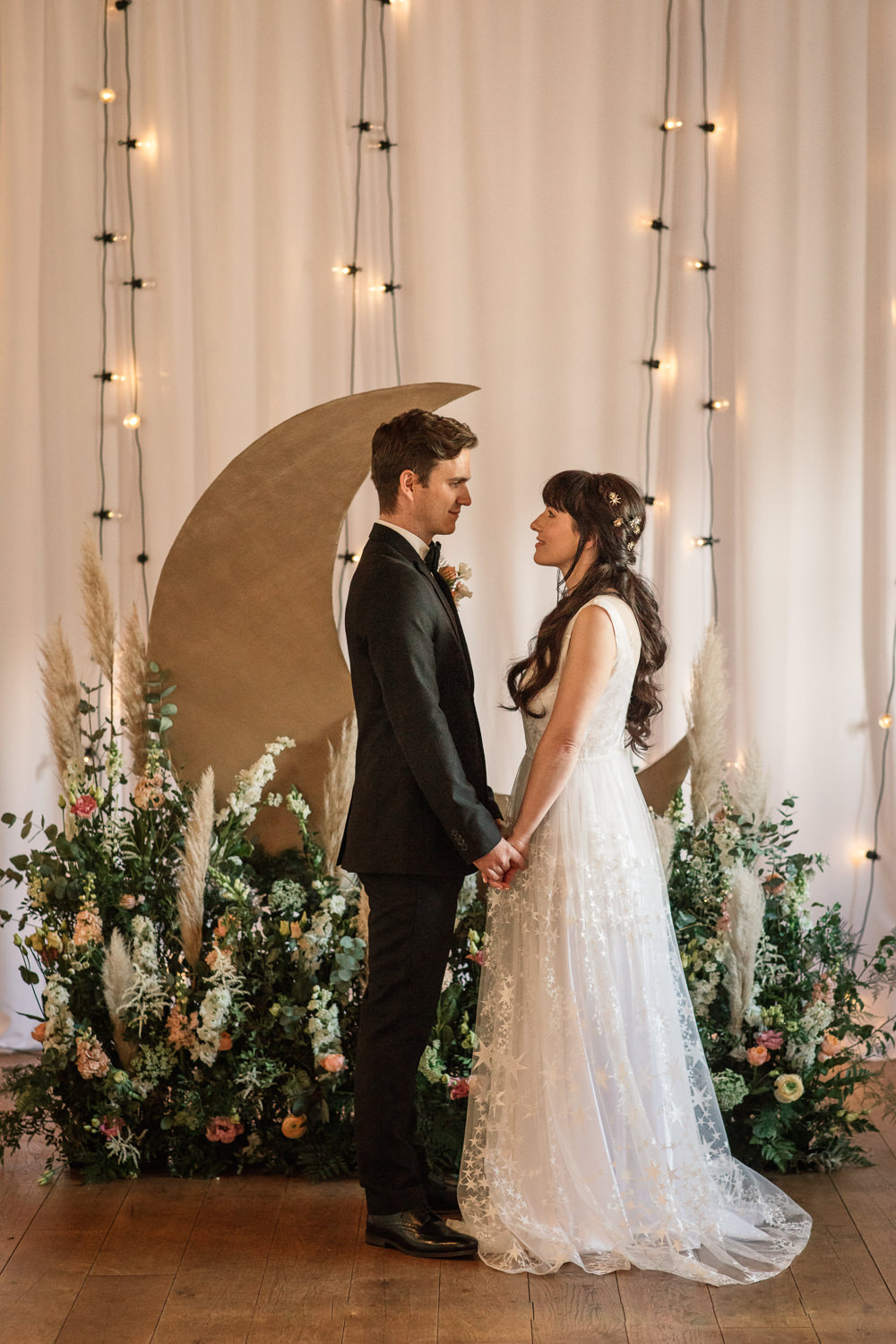 Celestial Wedding Inspiration Becky Harley Photography Moon Backdrop Crescent Fairy Lights Meadow Flowers