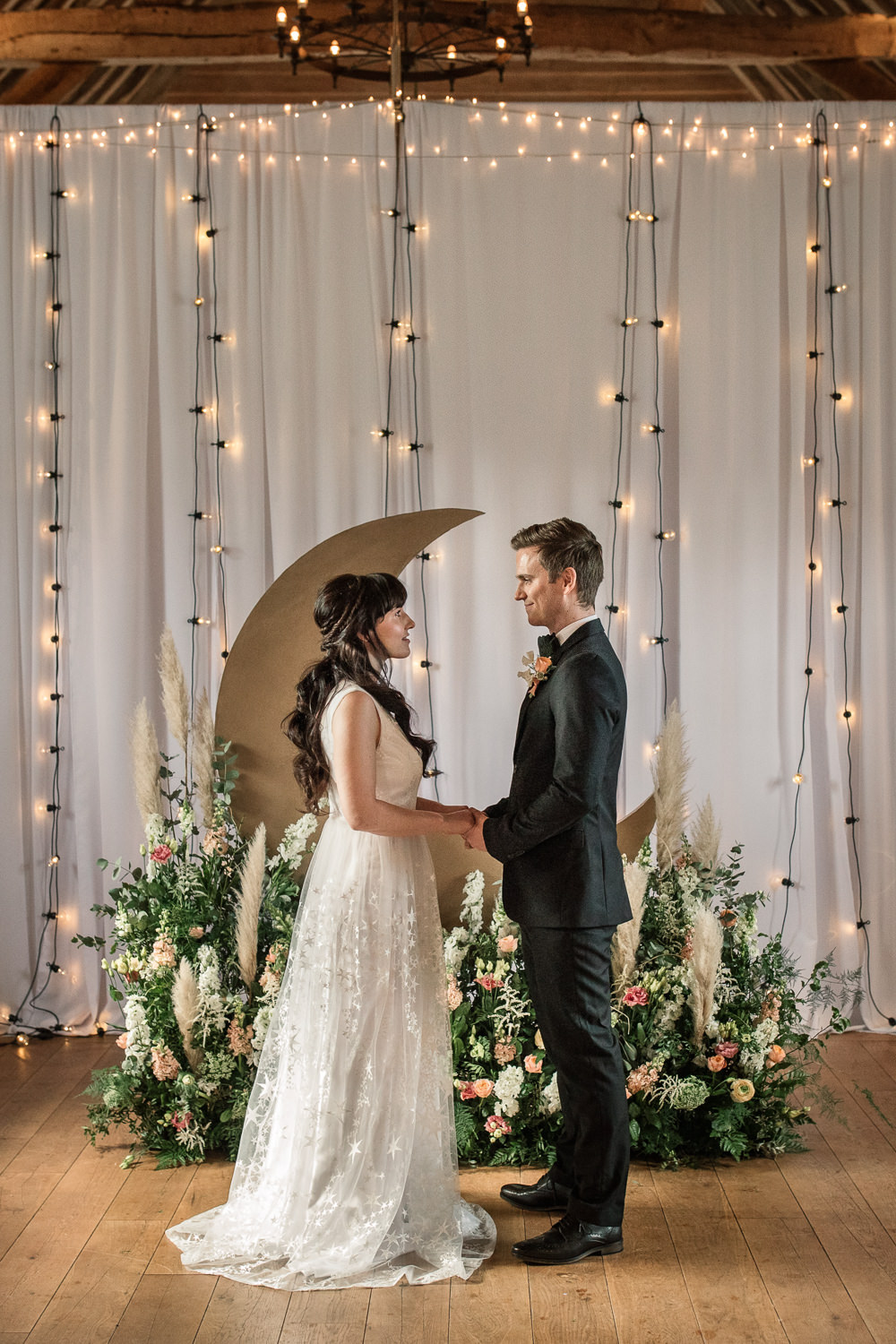 Celestial Wedding Inspiration Becky Harley Photography Moon Backdrop Crescent Fairy Lights Meadow Flowers