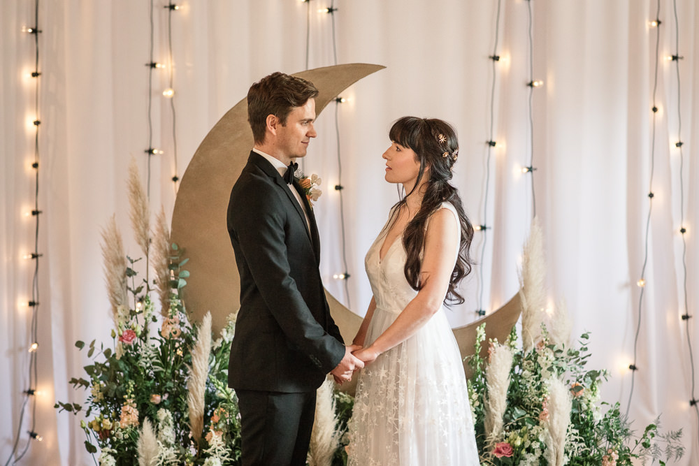 Celestial Wedding Inspiration Becky Harley Photography Moon Backdrop Crescent Fairy Lights Meadow Flowers