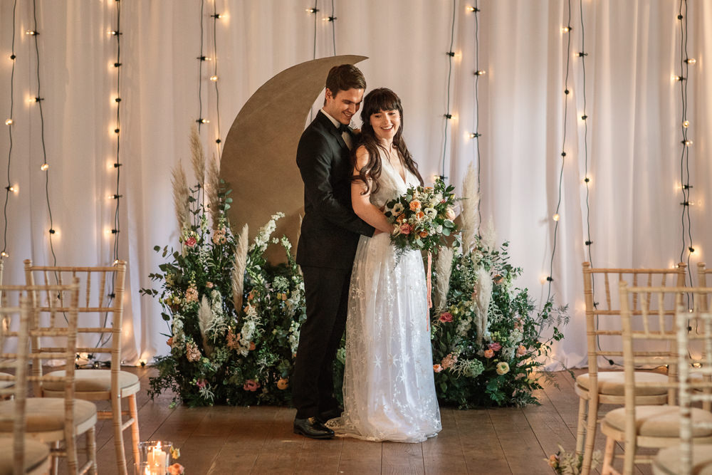 Celestial Wedding Inspiration Becky Harley Photography Moon Backdrop Crescent Fairy Lights Meadow Flowers