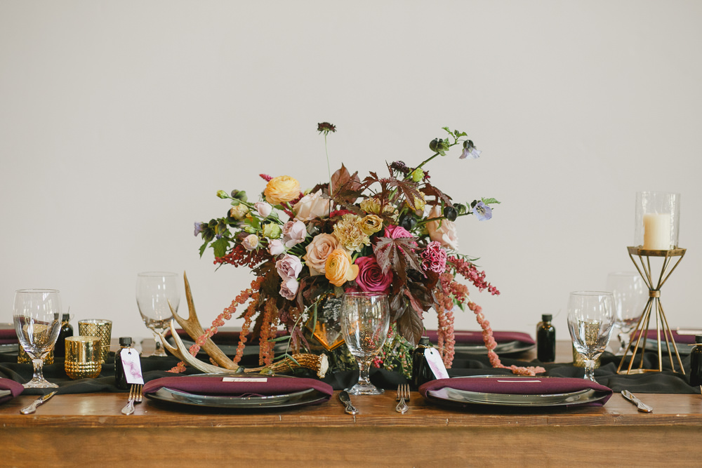 Table Decor Tablescape Flowers Black Plates Red Napkins Candles Enchanted Forest Wedding Kristen Booth Photography