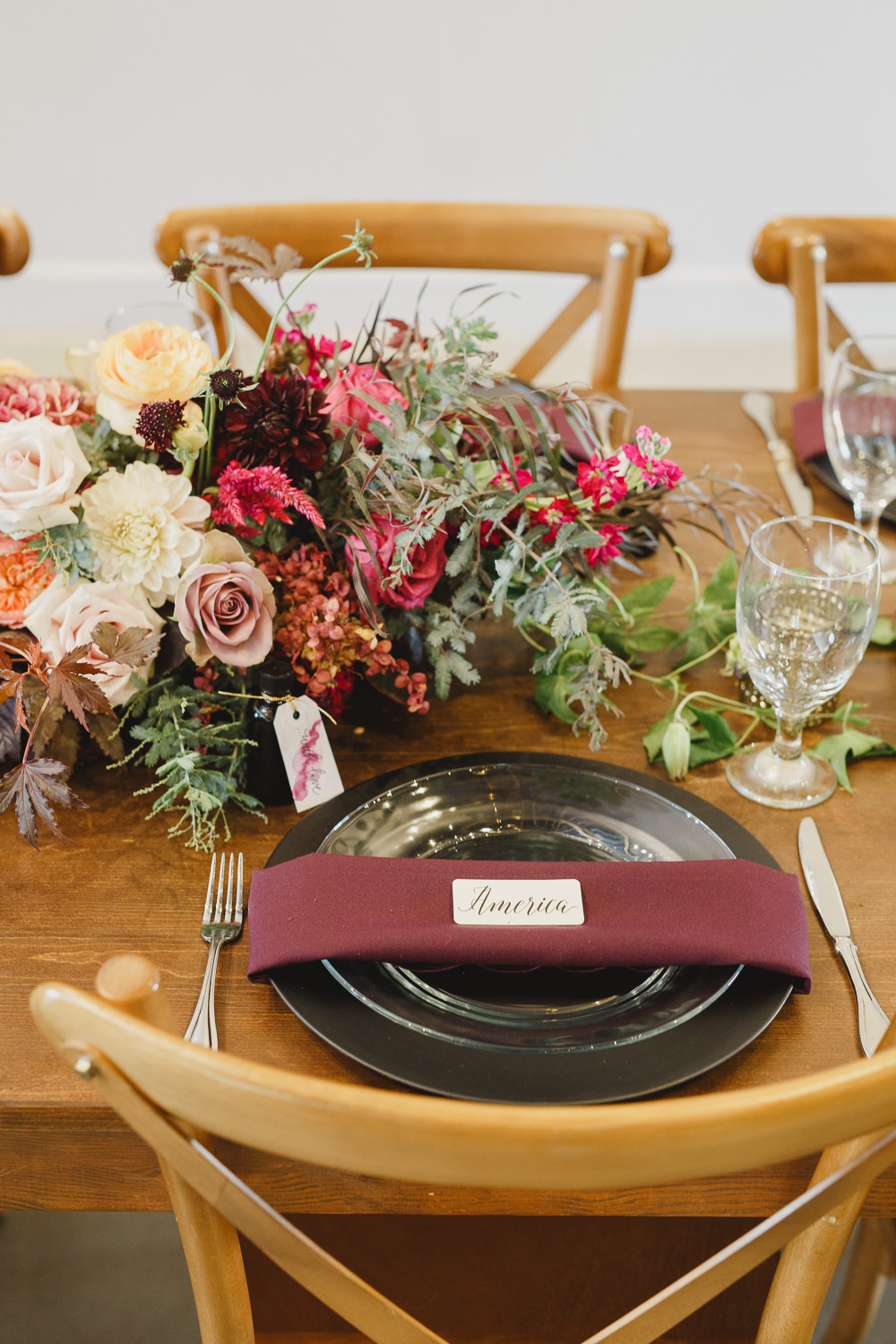 Table Decor Tablescape Flowers Black Plates Red Napkins Candles Enchanted Forest Wedding Kristen Booth Photography