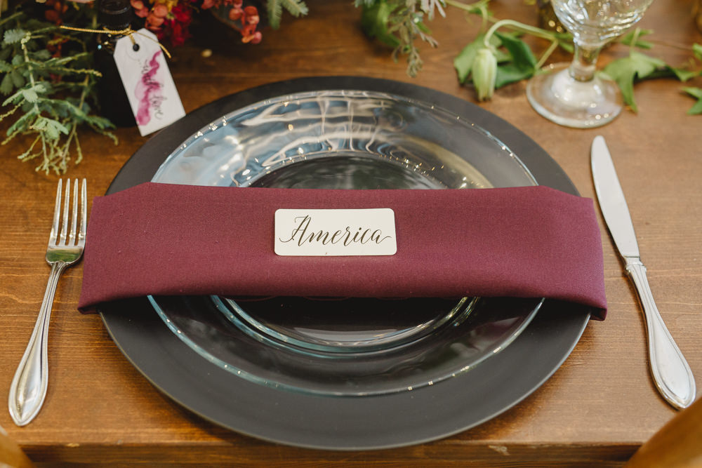 Table Decor Tablescape Flowers Black Plates Red Napkins Candles Enchanted Forest Wedding Kristen Booth Photography