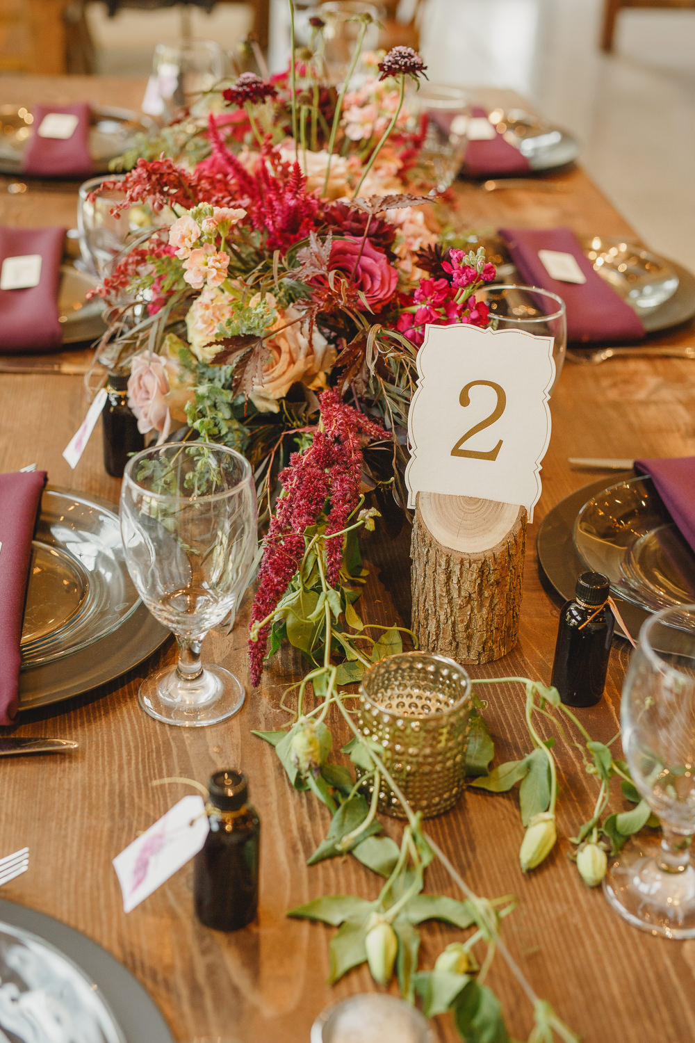 Table Decor Tablescape Flowers Black Plates Red Napkins Candles Log Table Number Enchanted Forest Wedding Kristen Booth Photography