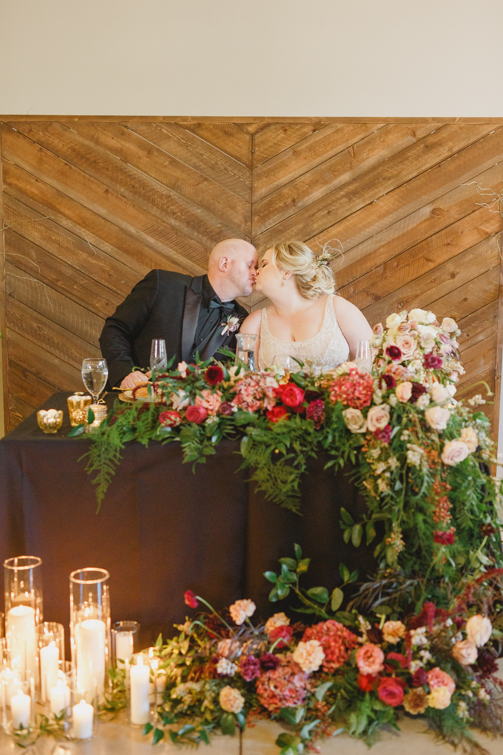 Table Decor Tablescape Flowers Black Plates Red Napkins Candles Top Table Sweetheart Enchanted Forest Wedding Kristen Booth Photography