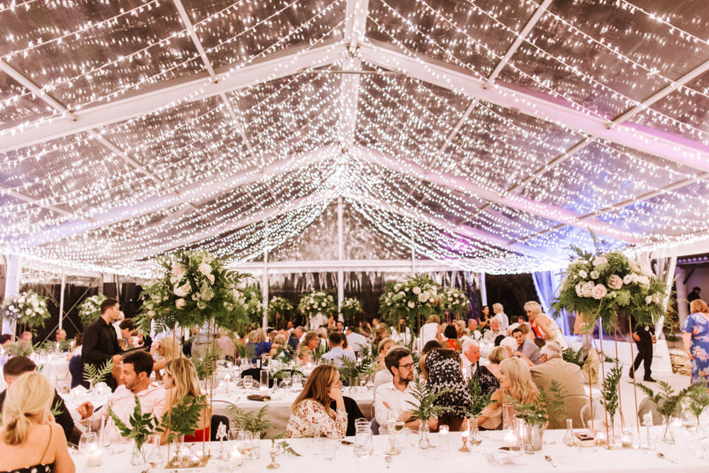 Clear Marquee Decor Long Tables Greenery Foliage Ghost Chairs Fairy Lights Lighting Portugal Destination Wedding The Lovers Imagery