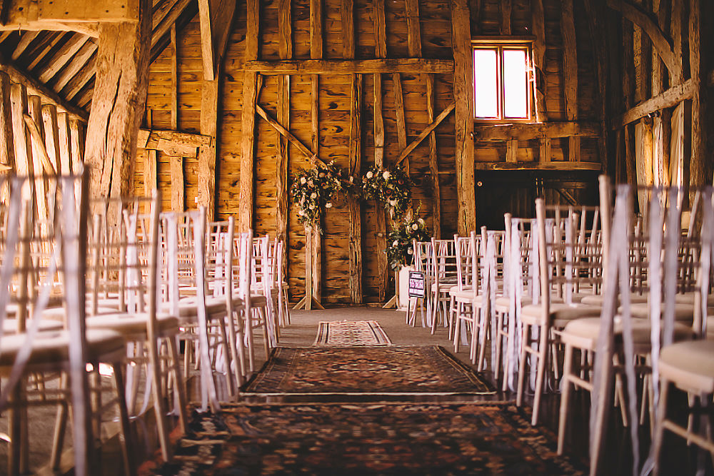 Ceremony Aisle Flower Arch Backdrop Greenery Suffolk Barn Wedding Carrie Lavers Photography