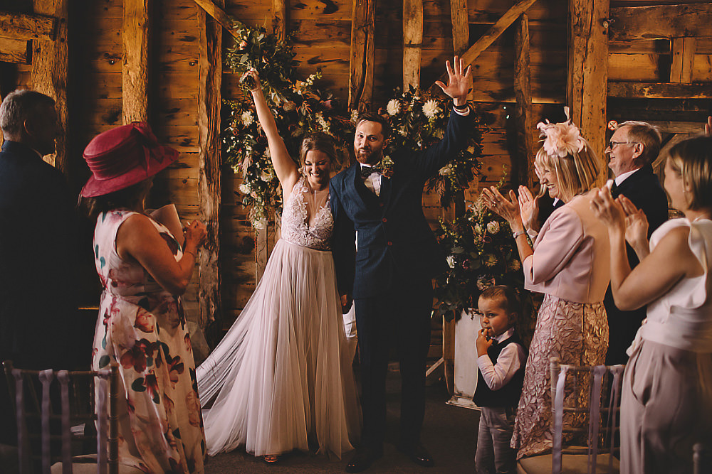 Ceremony Aisle Flower Arch Backdrop Greenery Suffolk Barn Wedding Carrie Lavers Photography