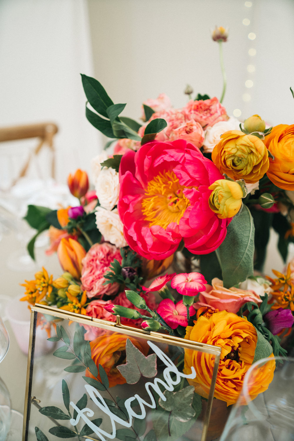 Centrepiece Flowers Bottles Peony Rose Coral Pink Orange Bright Wedding Sally T Photography