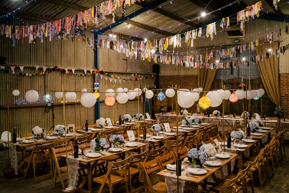 Rag Bunting Decor Barn Lanterns Fairy Lights Eclectic Wedding Paul and Tim Photographers