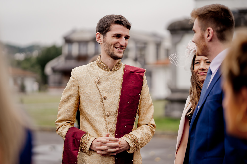 Gold Red Sherwani Groom Indian Wedding UK Laura May Photography