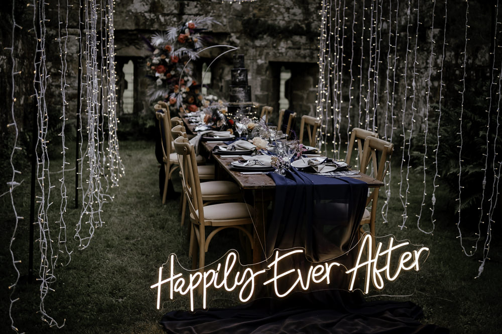 Fairy Light Tunnel Table Tablescape Decor Candles Runner Navy Neon Sign Midsummer Night's Dream Wedding Ideas Dani Louise Photography