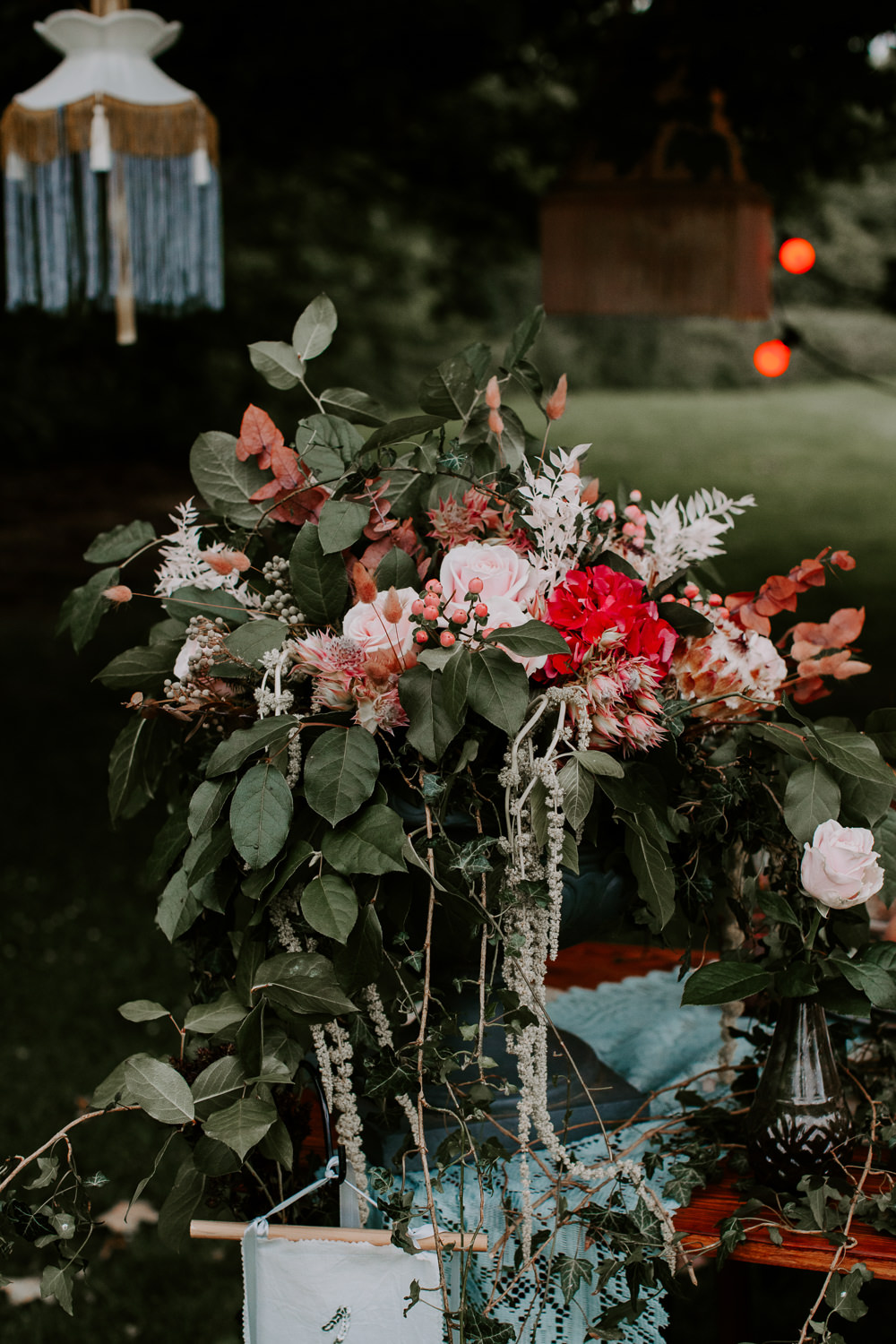 Table Flowers Centrepiece Greenery Red Pink Rose Hydrangea Berries Ivy Whimsical Wedding Ideas Charlotte Lucy Photography
