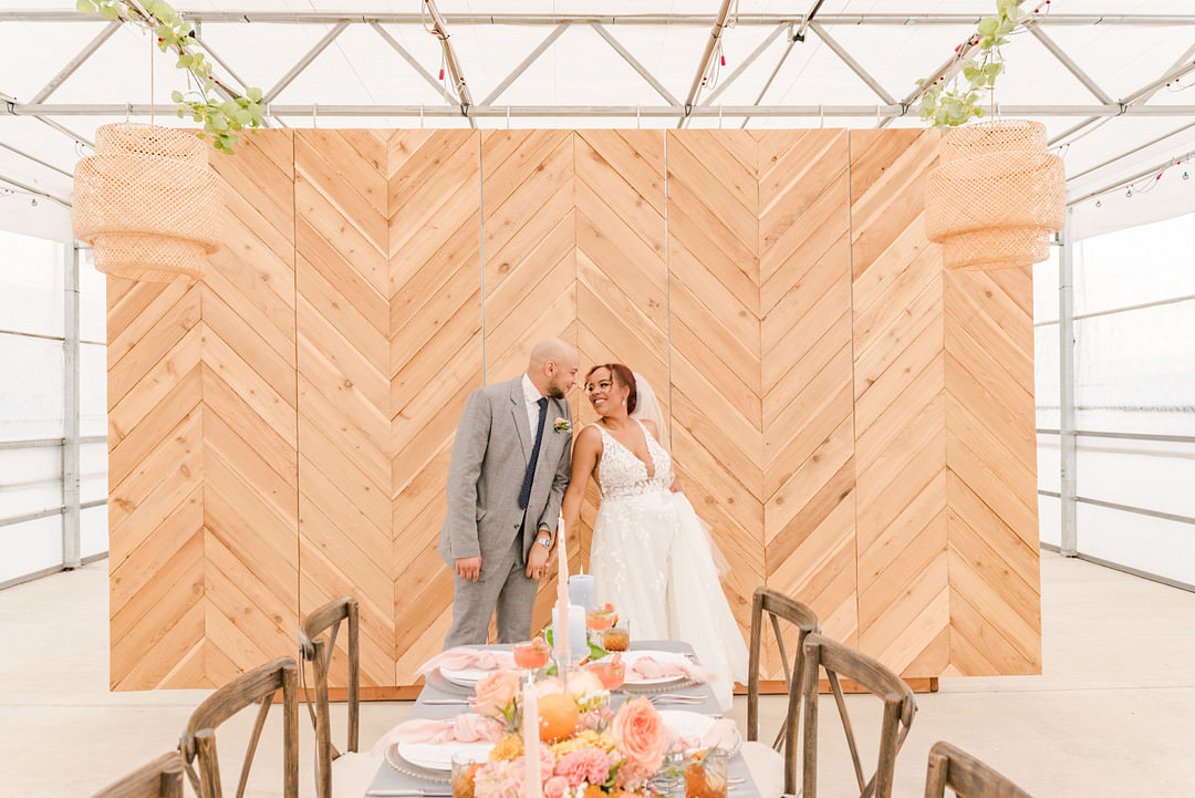 Citrus Wedding Ideas Pearls & Pines Photography Greenhouse Reception Venue Chevron Wooden Wall Backdrop