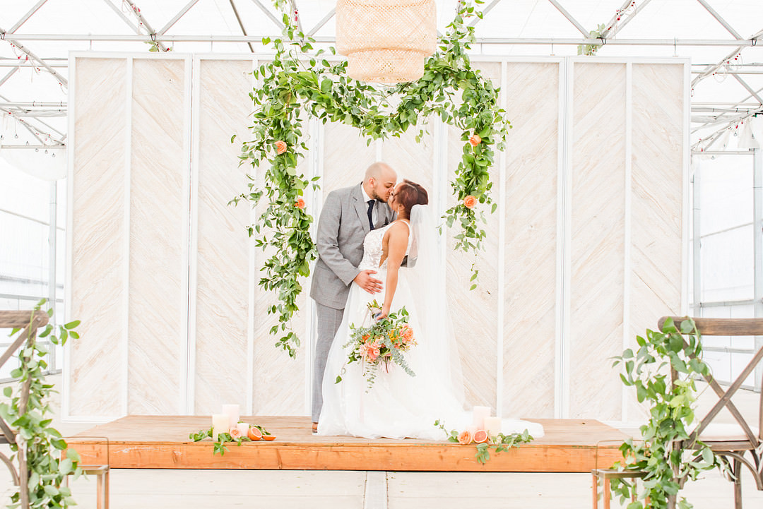 Citrus Wedding Ideas Pearls & Pines Photography Greenery Foliage Flower Arch Backdrop