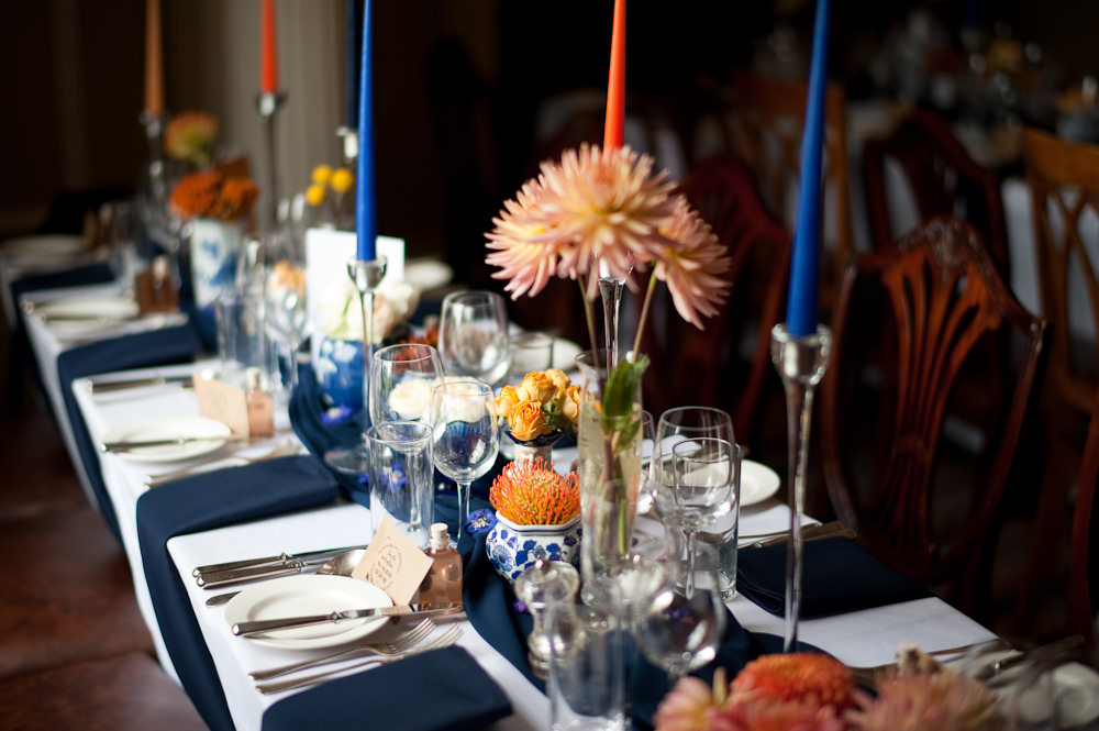 Coral Orange Dahlias Centrepiece Flowers Table Candles Blue Cloth Floral Wedding Rachael Connerton Photography