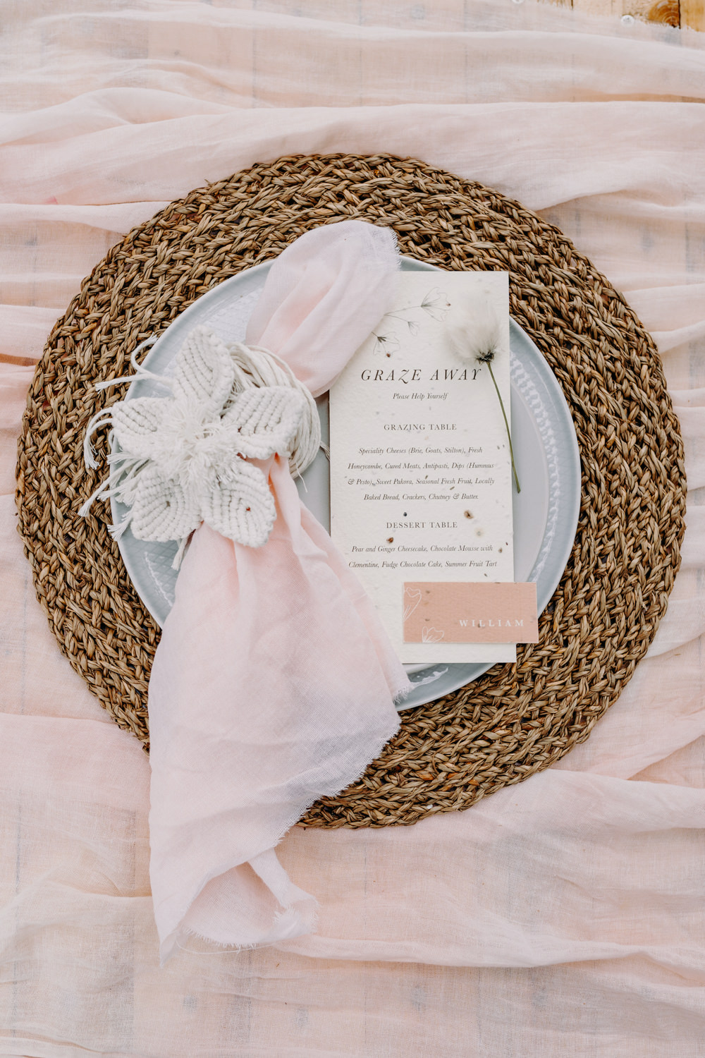 Place Setting Napkin Flower Rattan Sustainable Wedding Ideas EKR Pictures