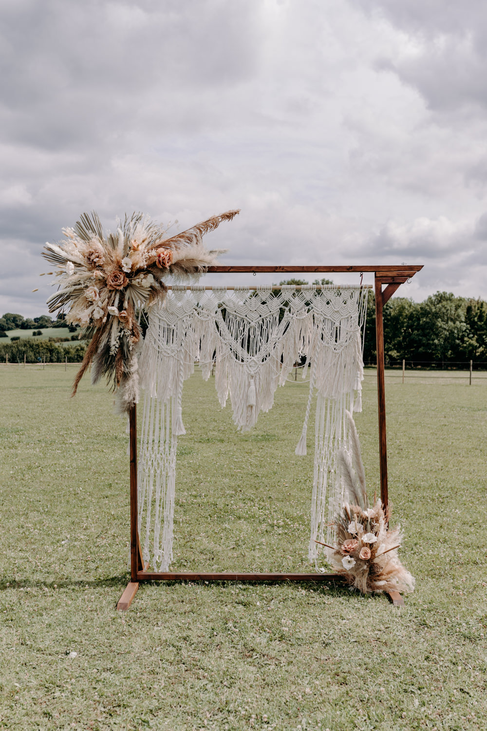 Macrame Backdrop Ceremony Frame Flowers Palms Pampas Grass Dried Flowers Sustainable Wedding Ideas EKR Pictures