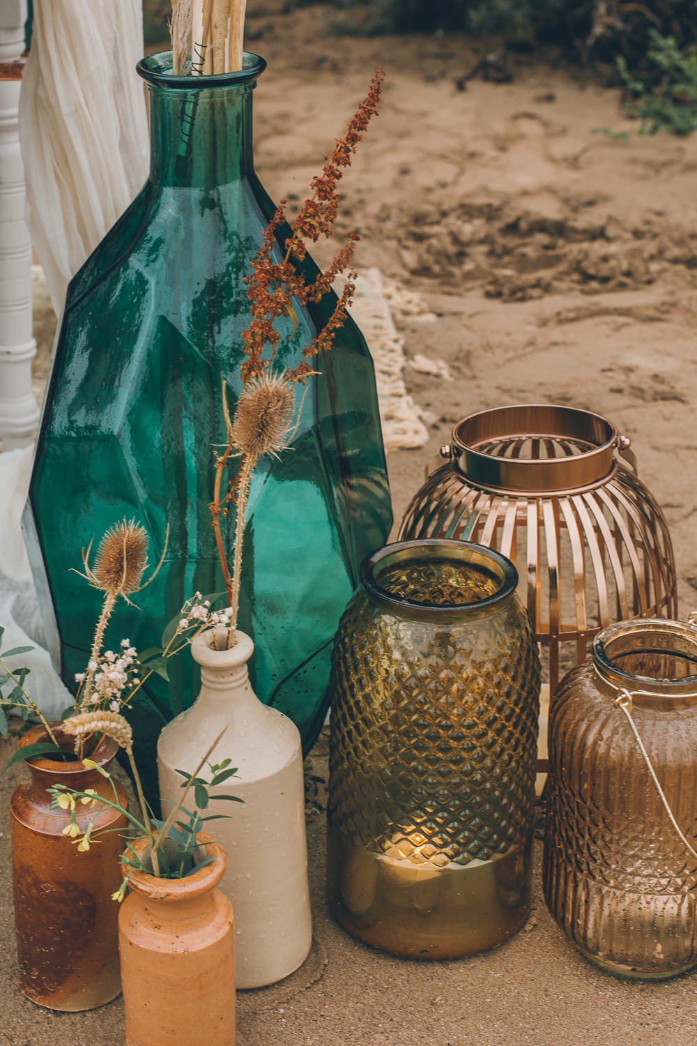 Earthenware Bottles Flowers Beach Wedding UK Maria Madison Photographer