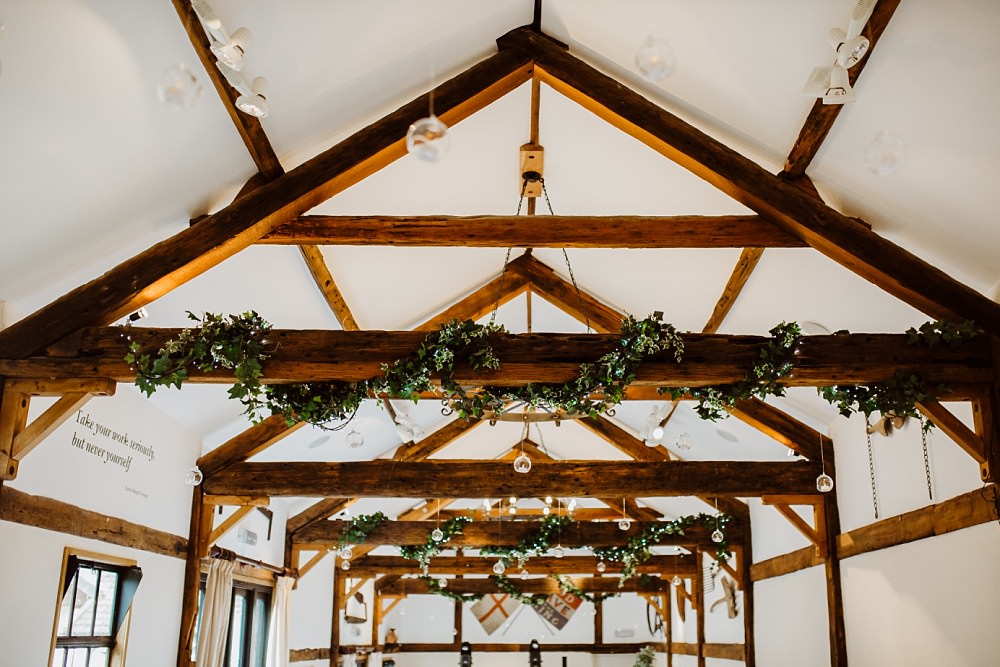 Beams Greenery Foliage Barn Greek English Wedding Holly Collings Photography
