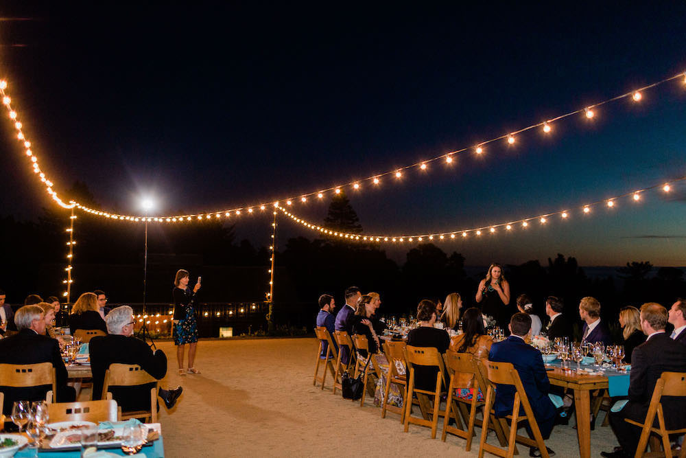 Outdoor Reception Long Wooden Tables Festoon Lights Pacific Coast Wedding Mallory Miya Photography