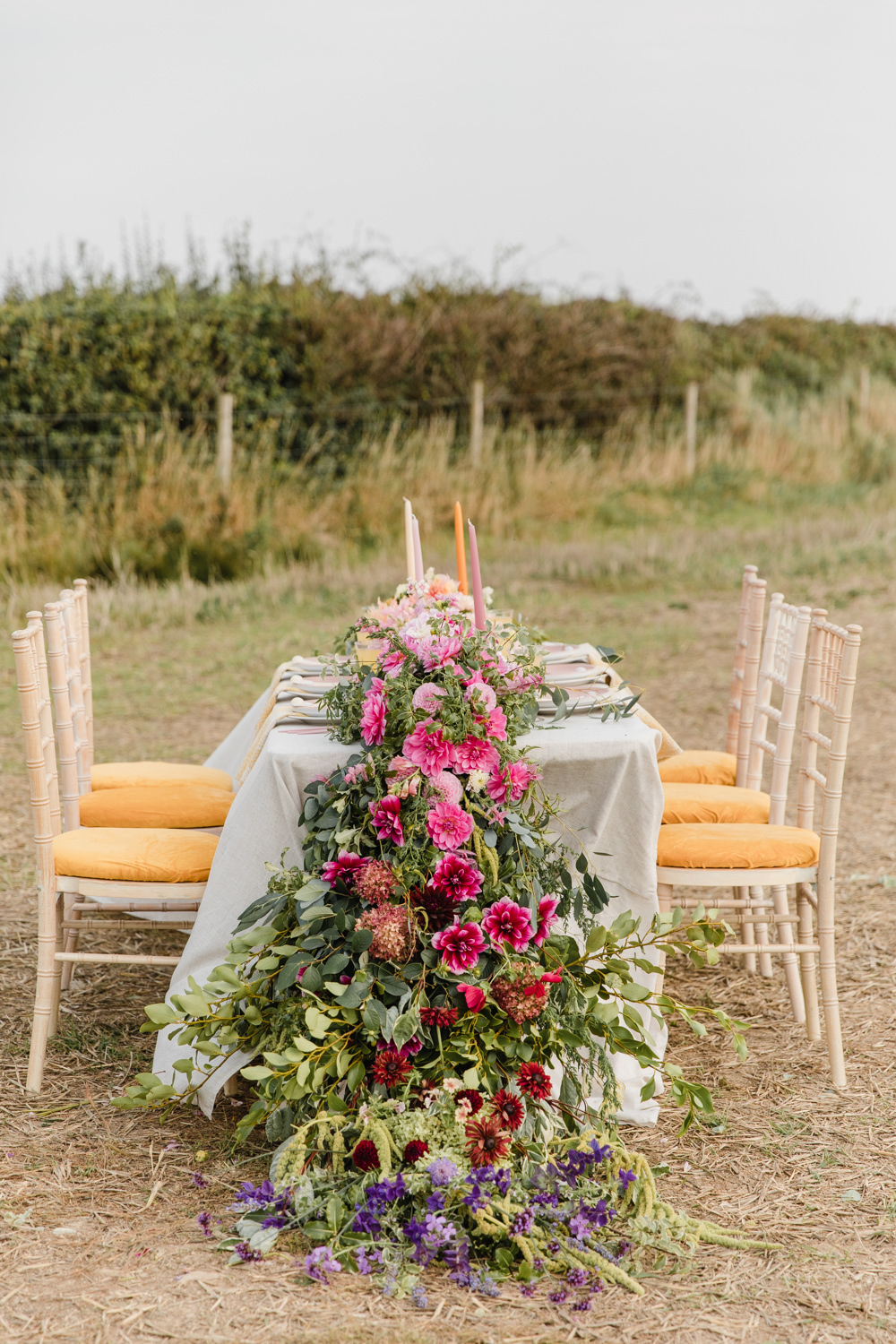 Table Tablescape Decor Flowers Ombre Pink Orange Yellow Candles Rainbow Wedding Ideas Michelle Huggleston Photography