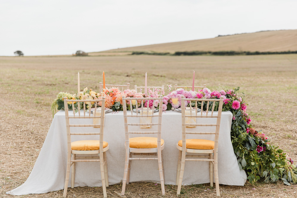 Table Tablescape Decor Flowers Ombre Pink Orange Yellow Candles Rainbow Wedding Ideas Michelle Huggleston Photography