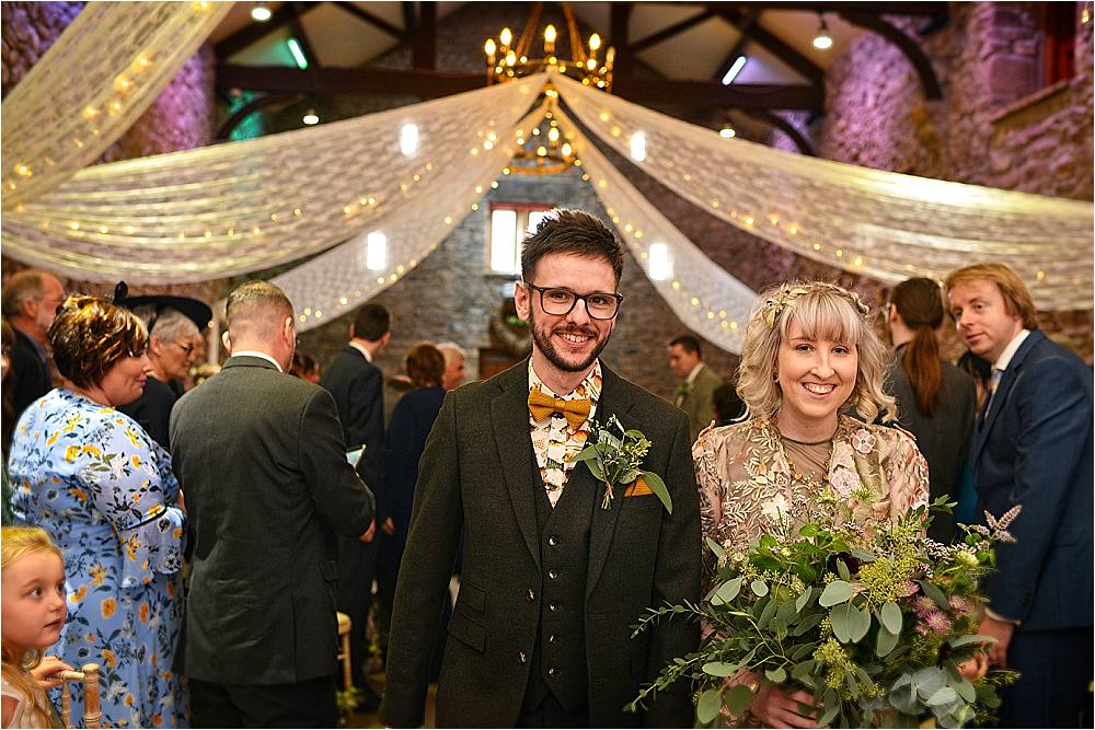 Barn Ceremony Fariy Lights Drapes Aisle Flowers Browsholme Hall Wedding Jules Fortune Photography