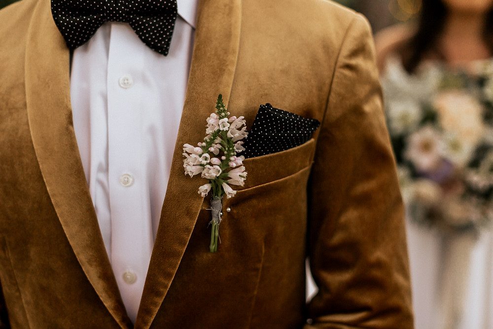 Groom Suit Velvet Jacket Gold Bow Tie Buttonhole Magical Fairytale Wedding Ideas Golden Vibes Photo