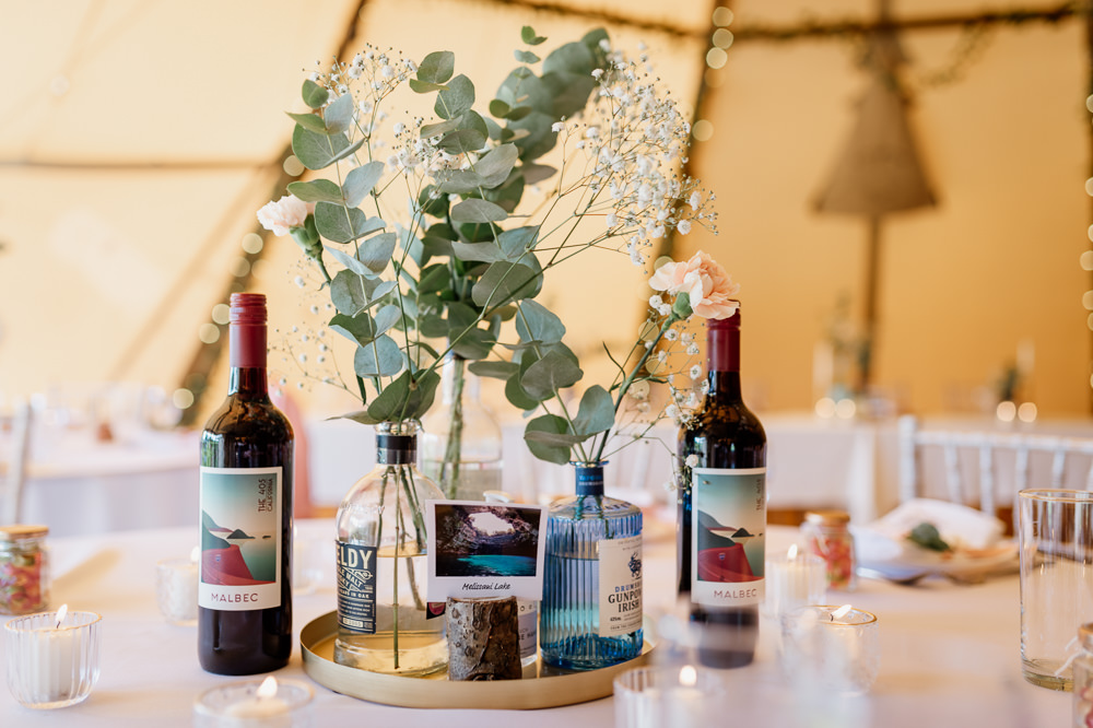 Centrepiece Decor Flowers Bottles Relaxed Tipi Wedding Twig and Vine Photography