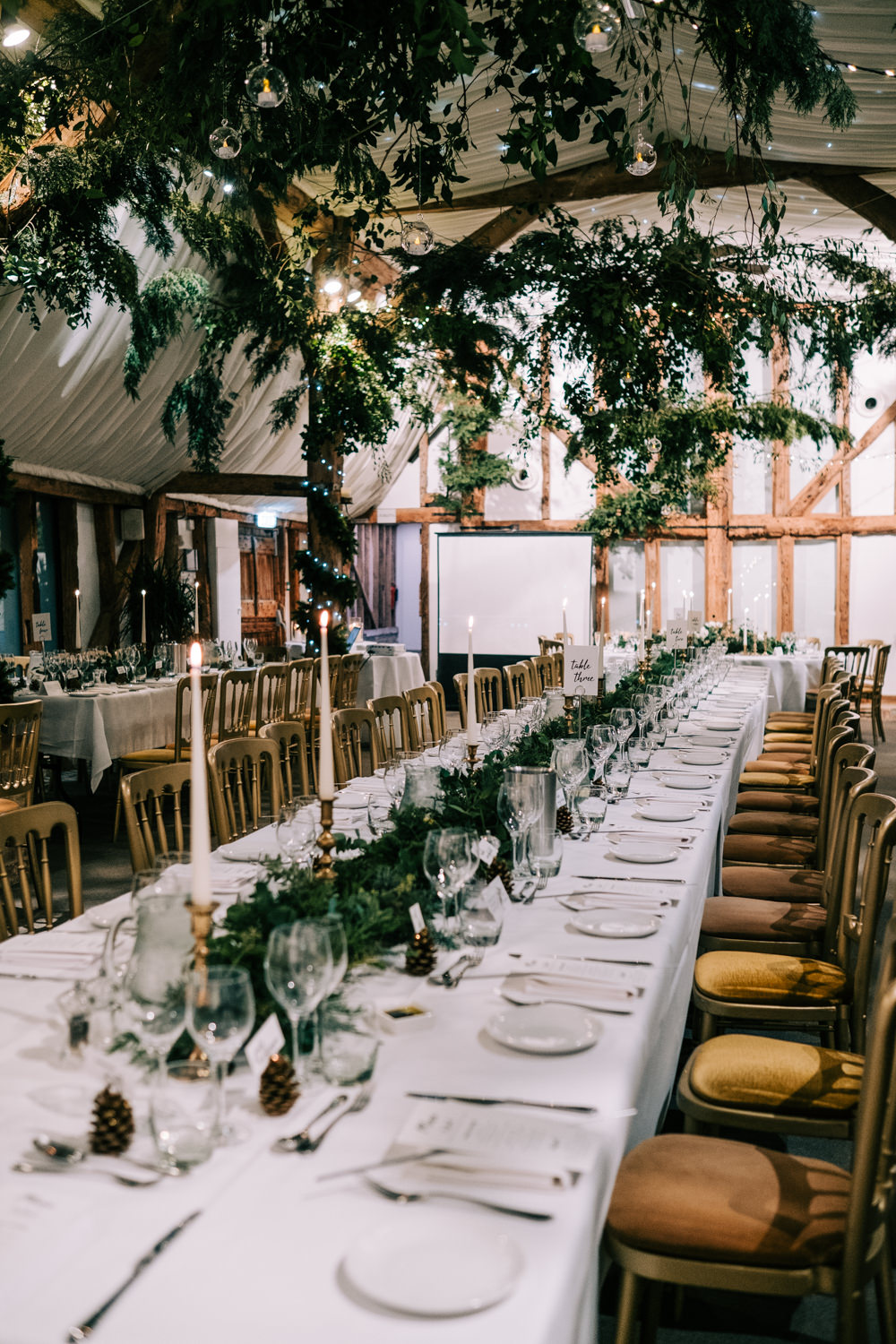 Greenery Foliage Barn Decor Festoon Lights Lighting South Farm Christmas Wedding Lee Allison Photography