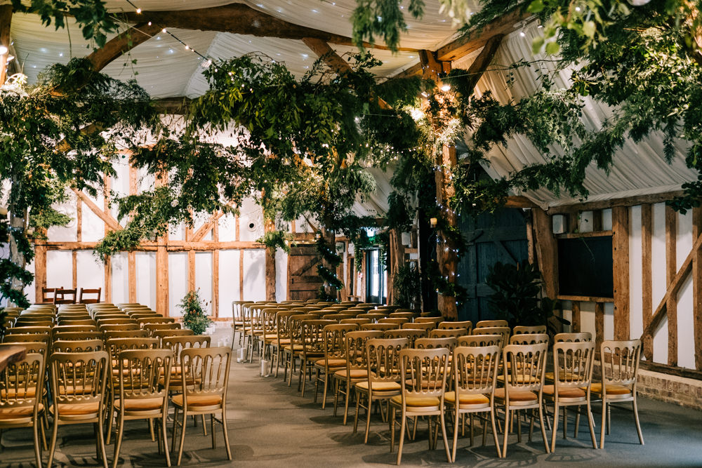Greenery Foliage Barn Decor Festoon Lights Lighting South Farm Christmas Wedding Lee Allison Photography