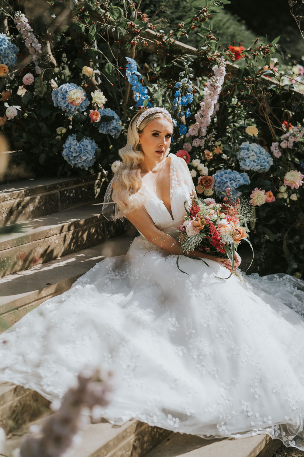 Stylish Floral Wedding Poppy Carter Portraits Dress Gown Bride Bridal Tulle Flower Arrangement Backdrop Stairs Staircase