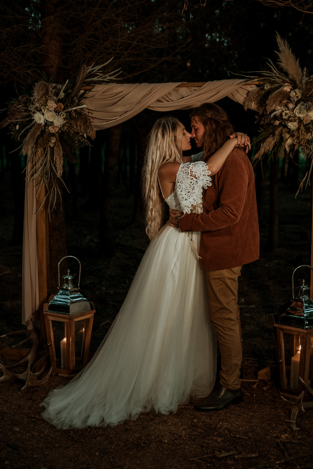 Wilderness Wedding Ideas Finn and the Fox Photography Ceremony Arch Fabric Flowers Candles