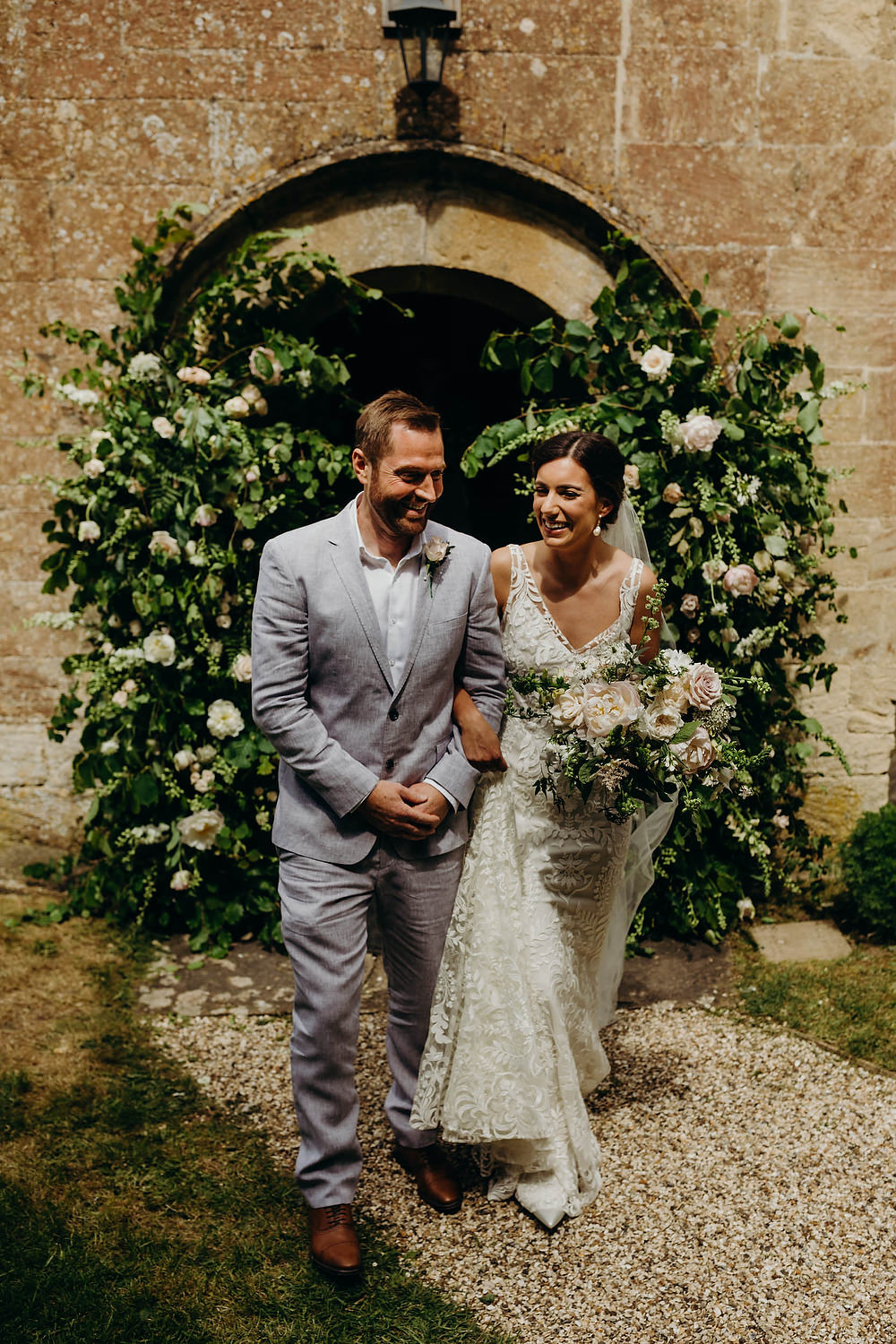 Berkshire Barn Wedding Richard Skins Photography Flower Arch Installation Greenery Foliage Doorway